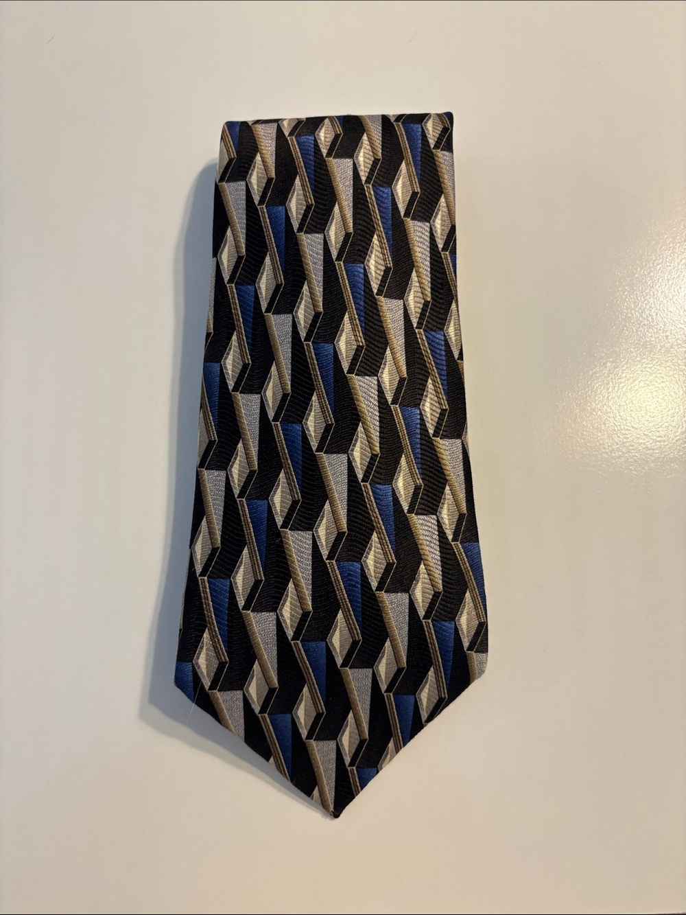 Black, silver, blue with a hint of brown tie 100% silk.